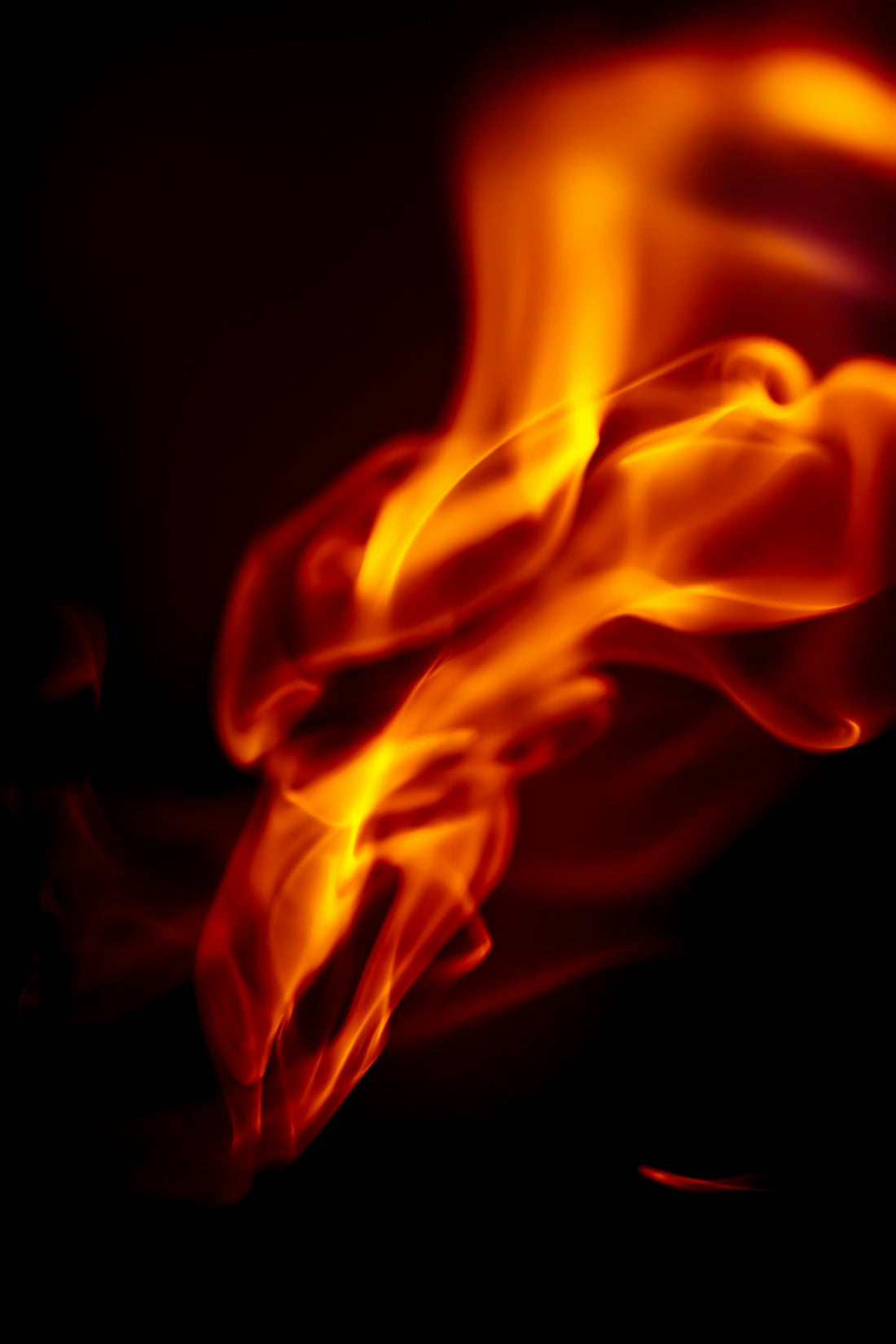 a close up of a fire on a black background