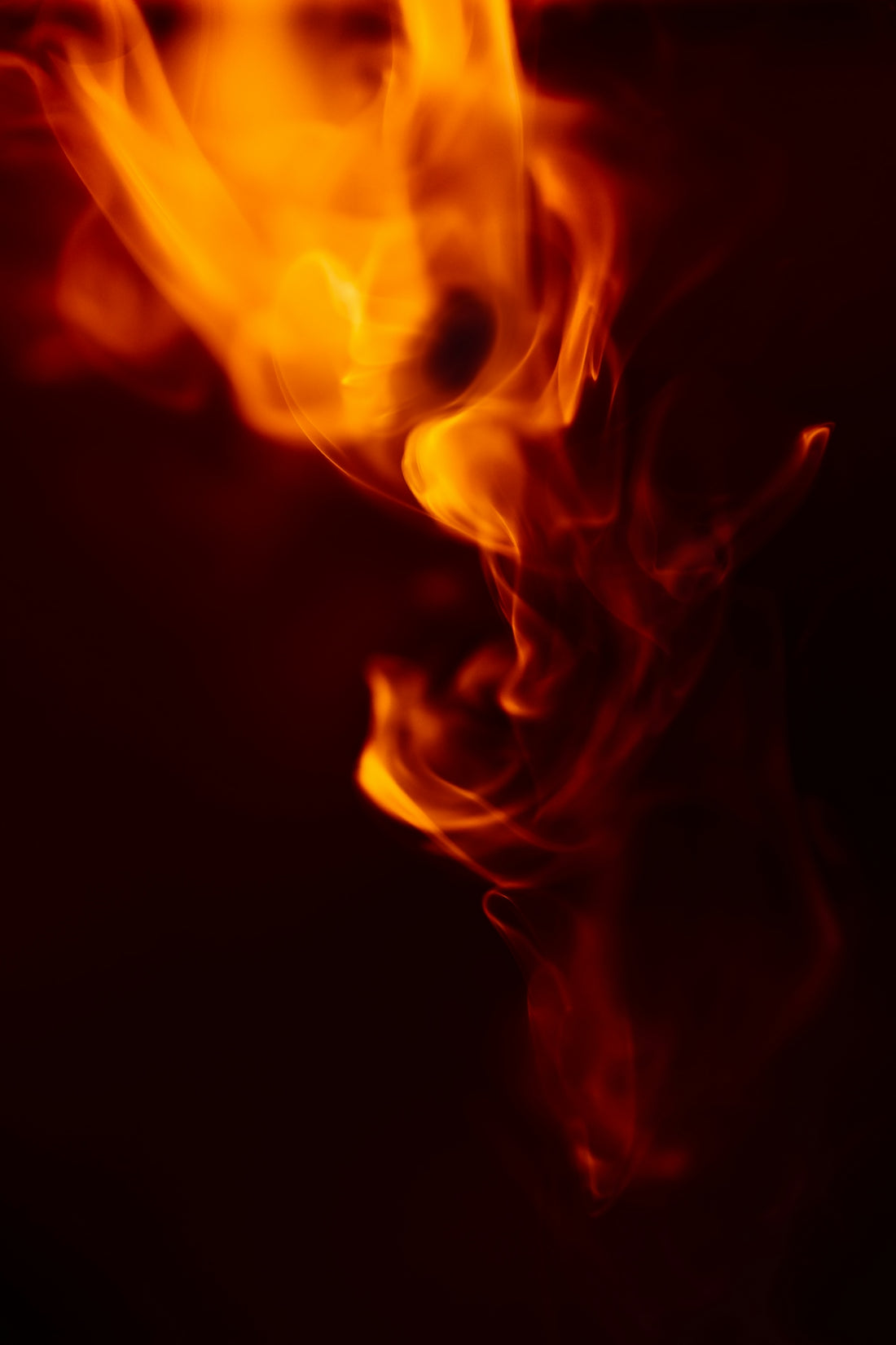 a close up of a fire with a blurry background