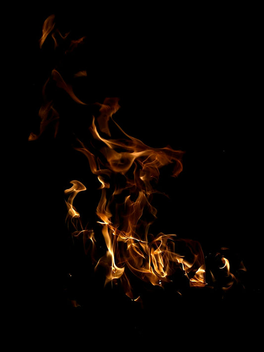 a close up of a fire on a black background