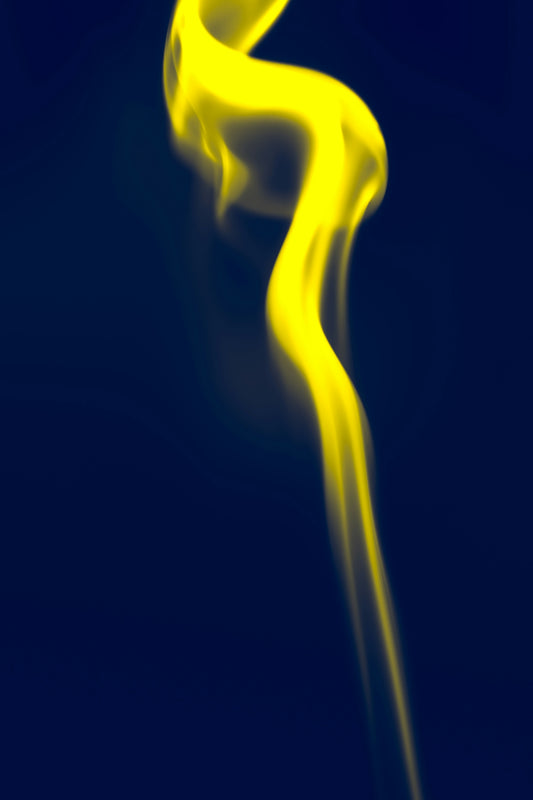 a blue background with yellow smoke coming out of it