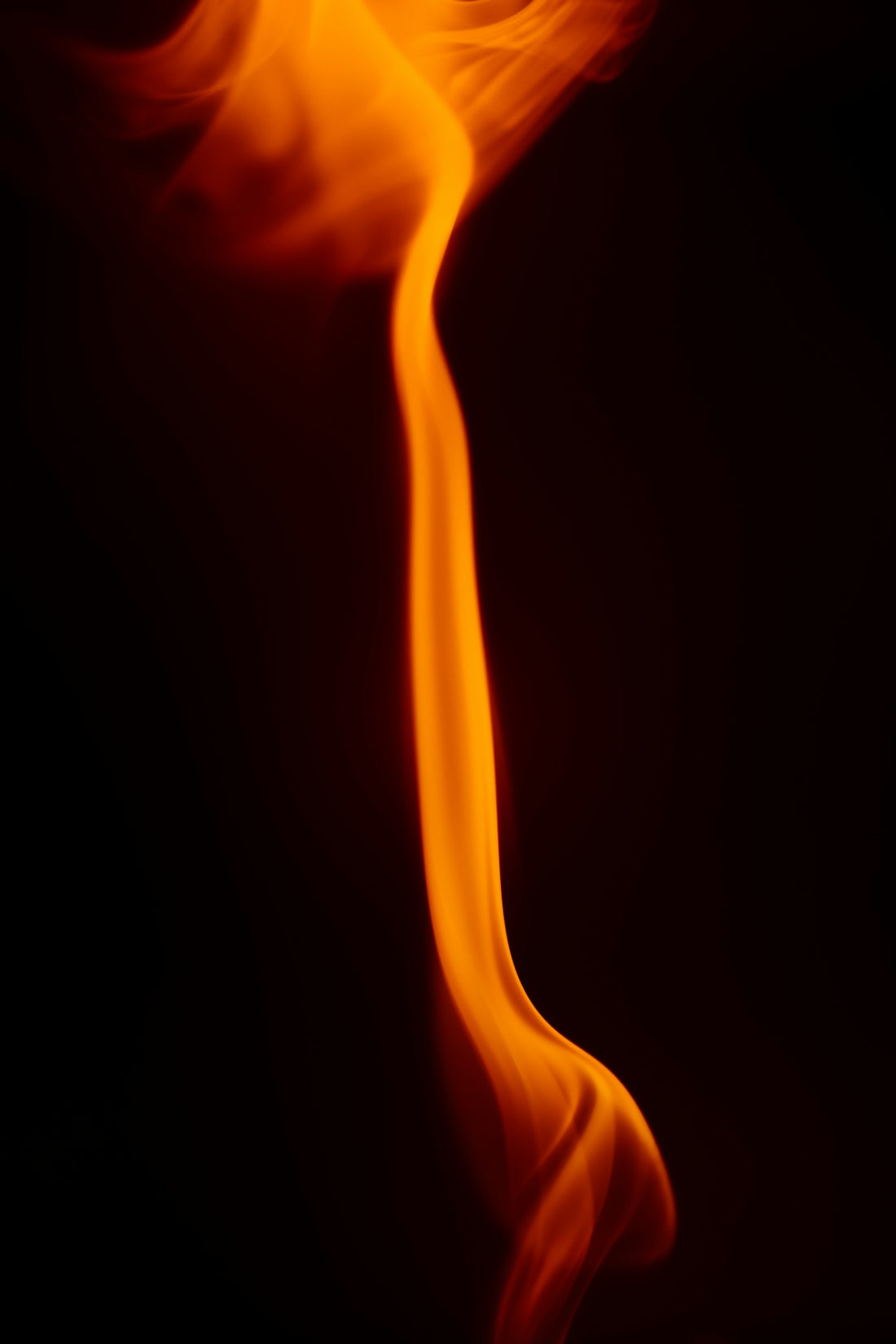 a close up of a fire on a black background