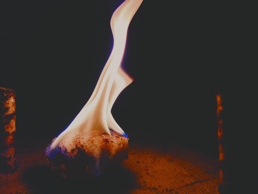 a close up of a fire with a black background