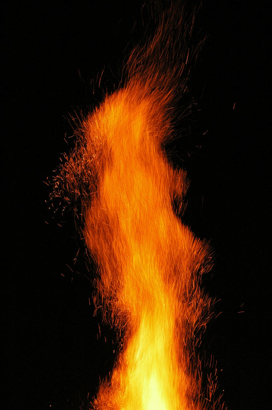 a close up of a fire on a black background