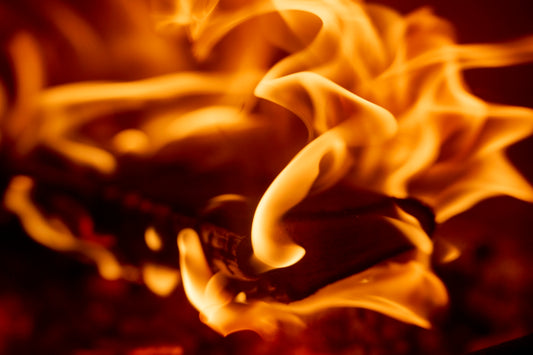 A close up of a fire with flames coming out of it