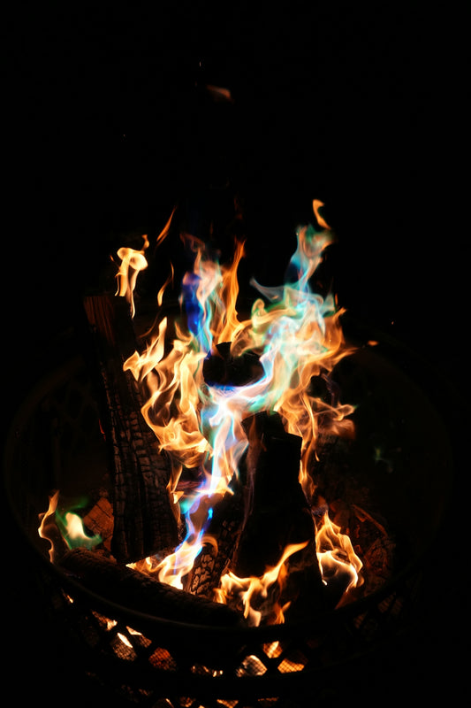 Colorful flames brighten the dark night.