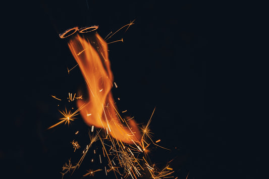 Fiery sparklers light up the dark night.